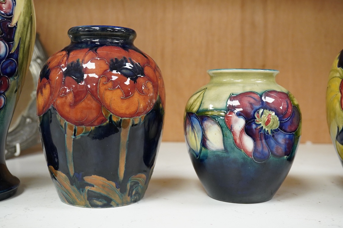Three Moorcroft vases and a Moorcroft Hibiscus jar and cover, largest 25cm high